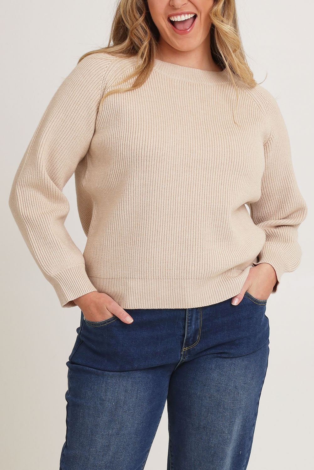 Model Chanel wearing size XL of the Always My Go To Jumper in colour Sand, from the front, cropped image