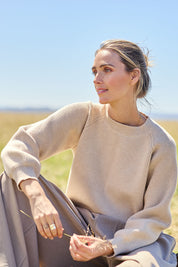 Model Tegan wearing size S of the Always My Go To Jumper in colour Sand, from the front, showing the whole outfit