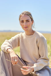 Model Tegan wearing size S of the Always My Go To Jumper in colour Sand, from the front, showing the whole outfit