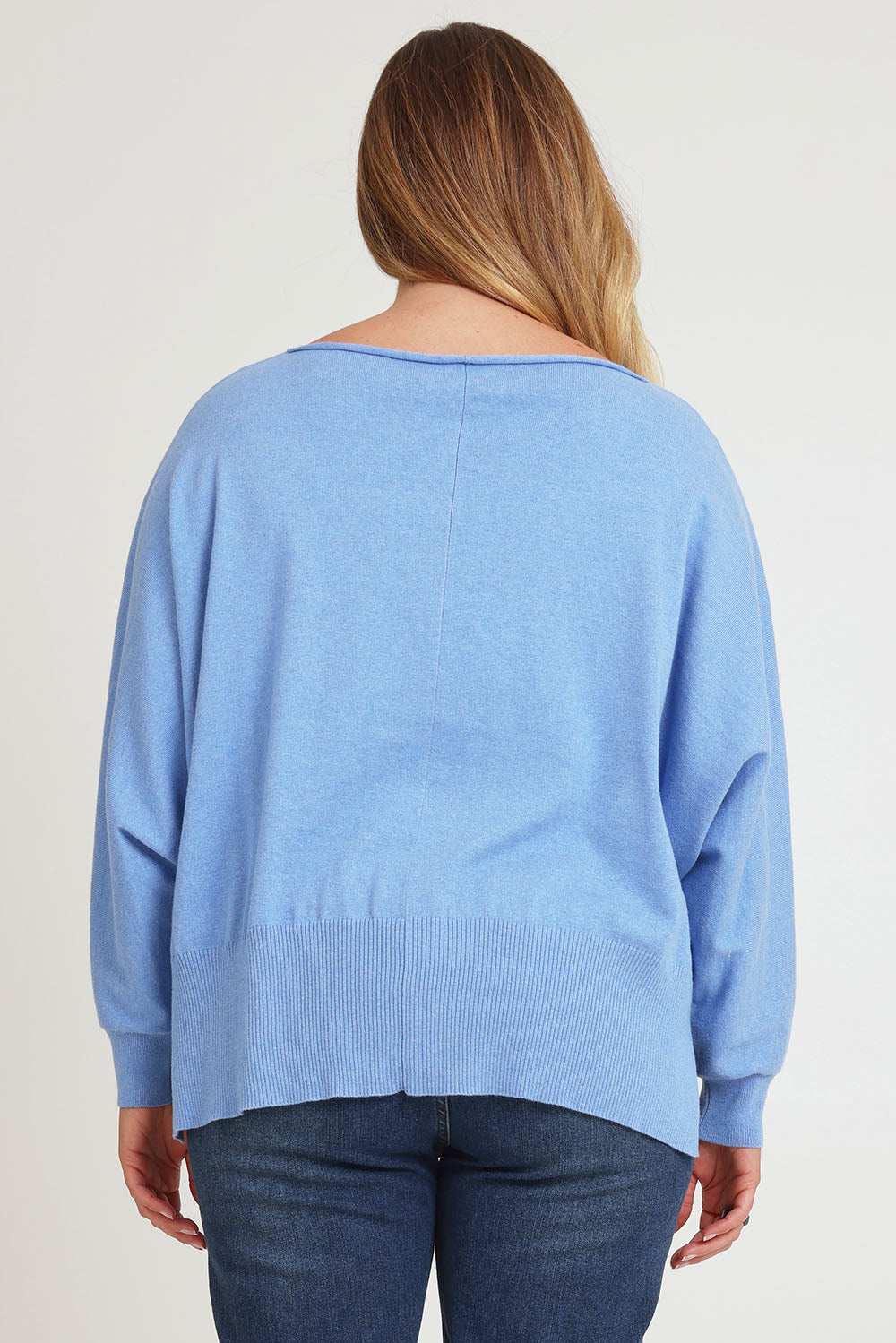 Model Chanel wearing size XL of the Have You Seam Me Cotton Cashmere Jumper in colour Bluebird (Blue), from the back