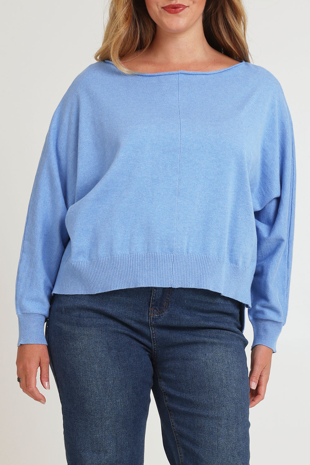 Model Chanel wearing size XL of the Have You Seam Me Cotton Cashmere Jumper in colour Bluebird (Blue), from the front, cropped image