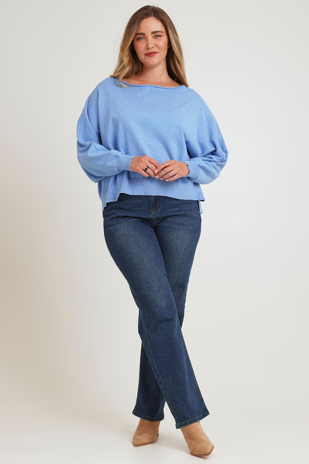 Model Chanel wearing size XL of the Have You Seam Me Cotton Cashmere Jumper in colour Bluebird (Blue), from the front, showing the whole outfit
