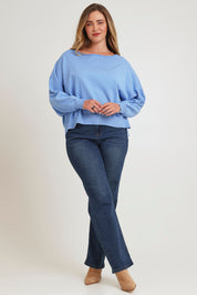 Model Chanel wearing size XL of the Have You Seam Me Cotton Cashmere Jumper in colour Bluebird (Blue), from the front, showing the whole outfit