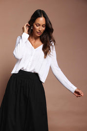 Model Amanda wearing size S of the Pretty In Pointelle Linen Blend Cardi in colour Milk (White), from the front, cropped image
