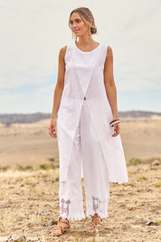 Model Tegan wearing size 10 of the Flying Free Cotton Top in colour White (White), from the front, showing the whole outfit