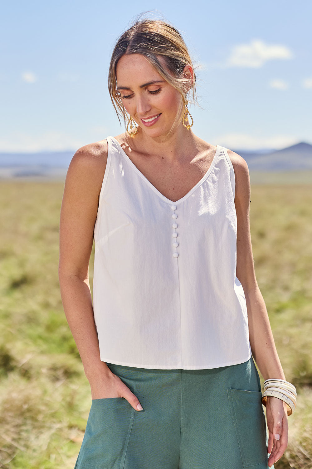 Model Tegan wearing size 10 of the Sweetie Pie Cotton Top in colour Milk (White), from the front, showing the whole outfit