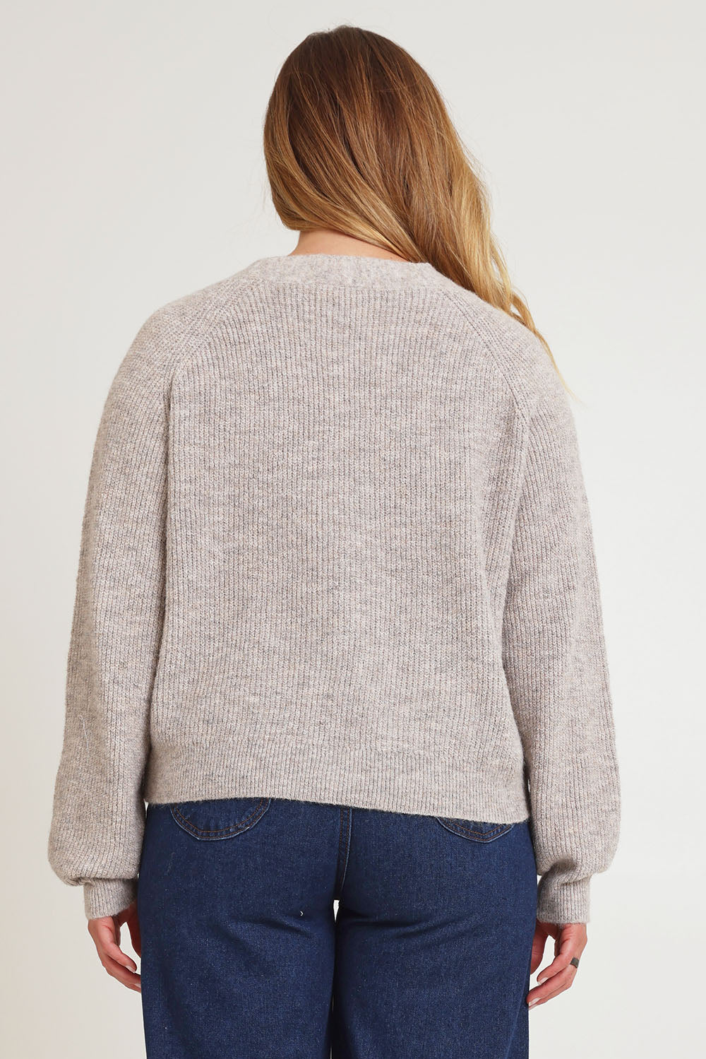 Model Chanel wearing size XL of the Found My Friend Recycled Knit Cardi in colour Oatmeal, from the back