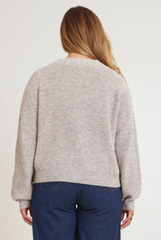 Model Chanel wearing size XL of the Found My Friend Recycled Knit Cardi in colour Oatmeal, from the back