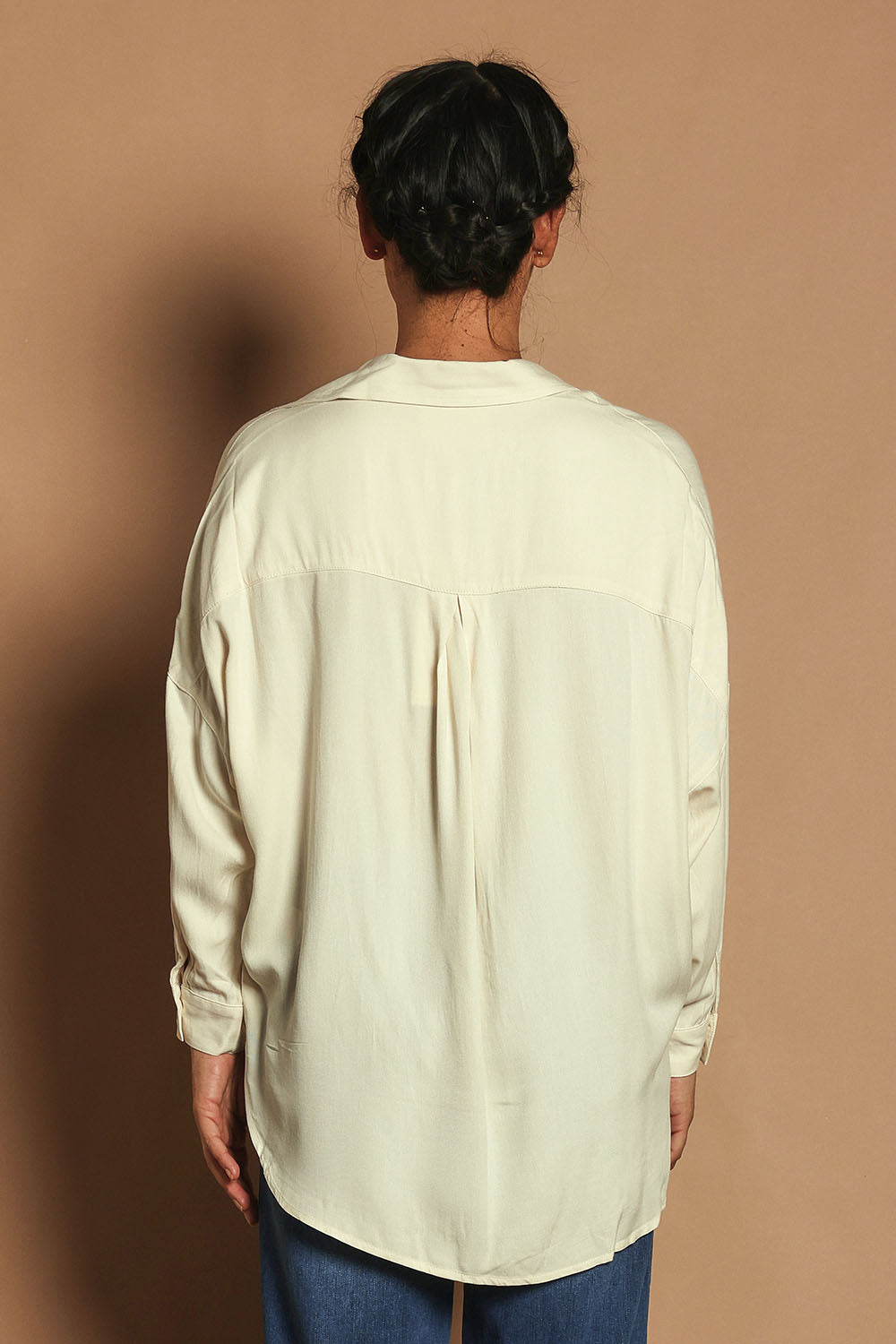 Model Katie wearing size 10 of the Easy Does It Popover Shirt in colour Latte, from the back