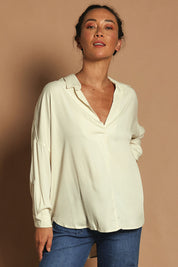Model Katie wearing size 10 of the Easy Does It Popover Shirt in colour Latte, from the front, cropped image