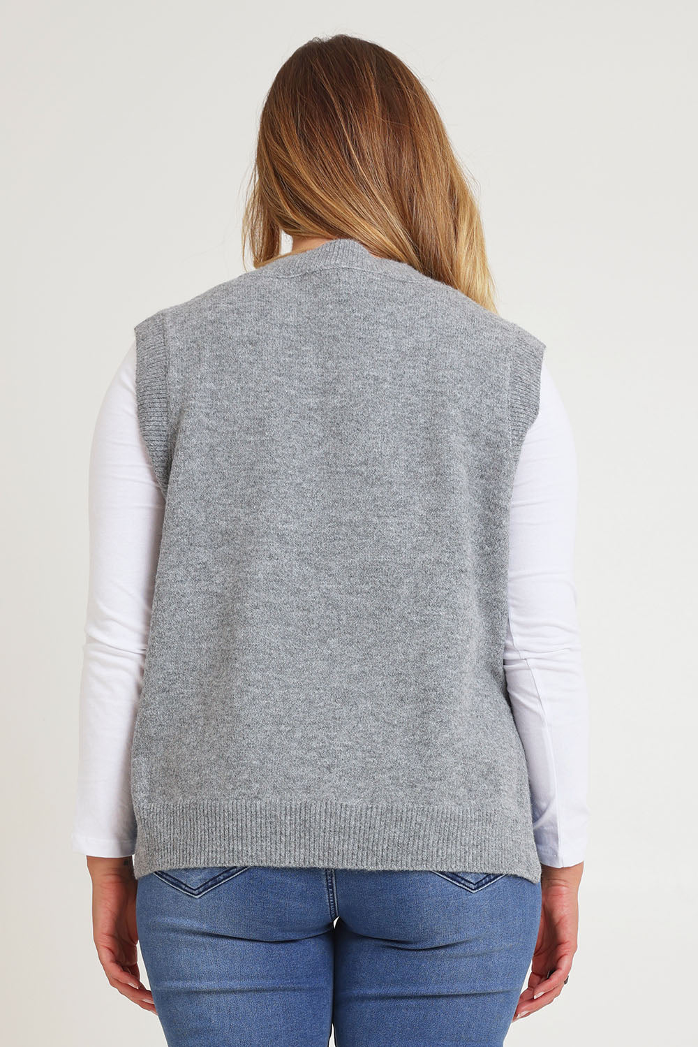 Model Chanel wearing size XL of the Found My Friend Recycled Knit Vest in colour Greymarle (Grey), from the back