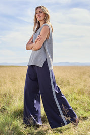 Model Tegan wearing size S of the Found My Friend Recycled Knit Vest in colour Greymarle (Grey), from the front, showing the whole outfit