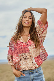 Model Amanda wearing size 10 of the Happy Daze Shirt in colour Patch (Pink), from the front, showing the whole outfit