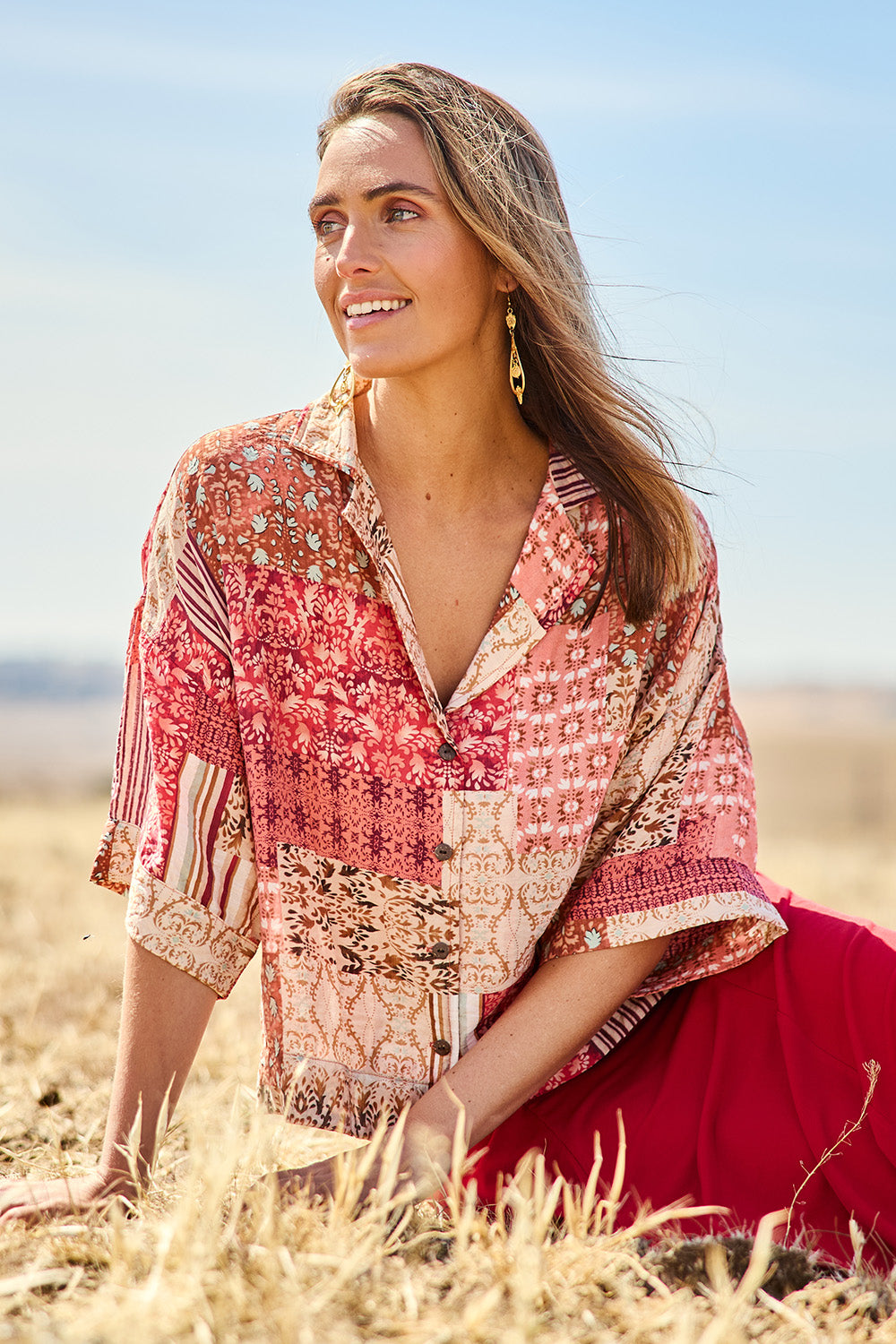 Model Tegan wearing size 10 of the Happy Daze Shirt in colour Patch (Pink), from the front, cropped image