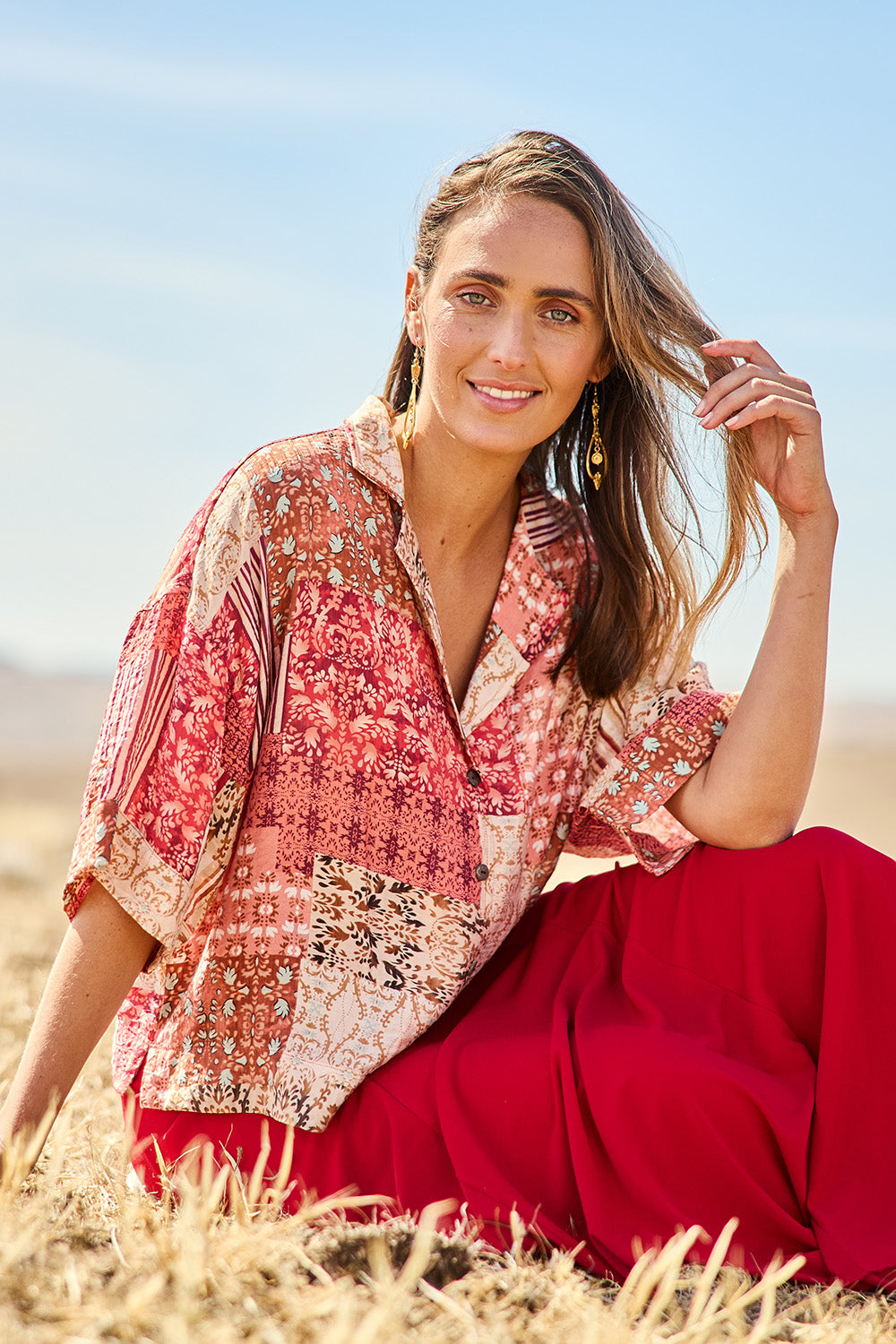 Model Tegan wearing size 10 of the Happy Daze Shirt in colour Patch (Pink), from the front, cropped image