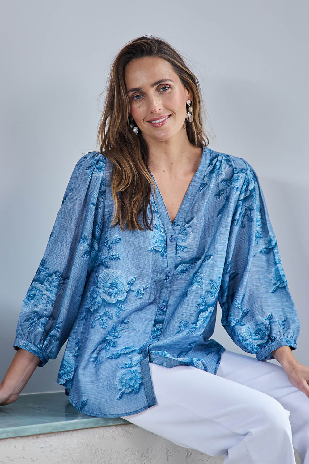Model Tegand wearing size 10 of the Easy On Me Tencel And Linen Blend Blouse - Bluefleur in colour Bluefleur, in a cropped view