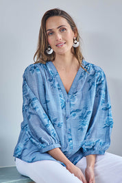 Model Tegand wearing size 10 of the Easy On Me Tencel And Linen Blend Blouse - Bluefleur in colour Bluefleur, in a cropped view