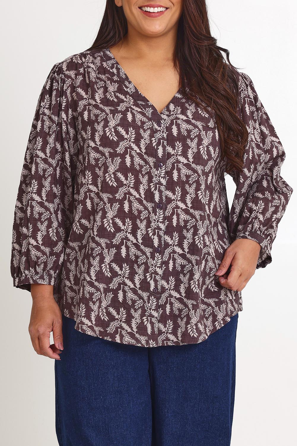 Model Ashleigh wearing size 16 of the Easy On Me Blouse in colour Charcoal (Grey), from the front, cropped image