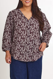 Model Ashleigh wearing size 16 of the Easy On Me Blouse in colour Charcoal (Grey), from the front, cropped image