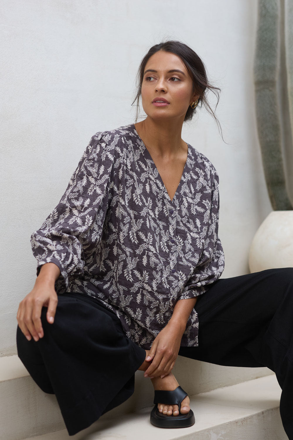 Model Tahnee wearing size 10 of the Easy On Me Blouse in colour Charcoal (Grey), from the front, showing the whole outfit