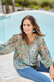 Model Tegand wearing size 10 of the Easy On Me Blouse – Greenfolk in colour Greenfolk, in a cropped view