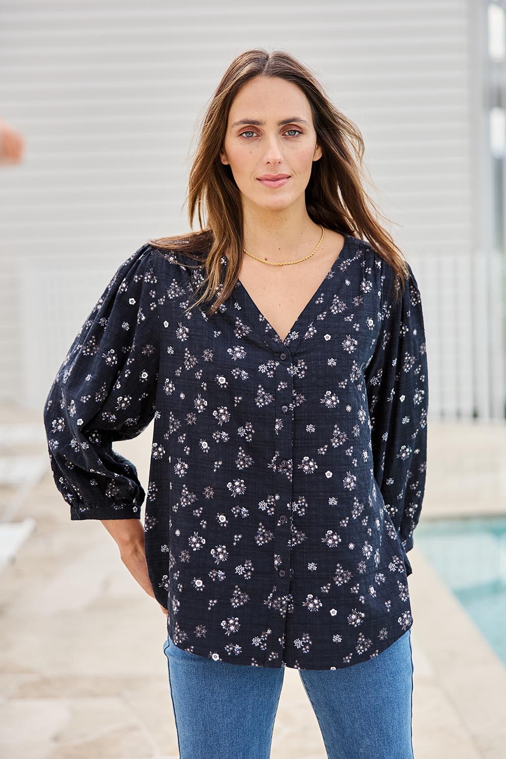 Model Tegand wearing size 10 of the Easy On Me Blouse – Navyfleur in colour Navyfleur, in a cropped view