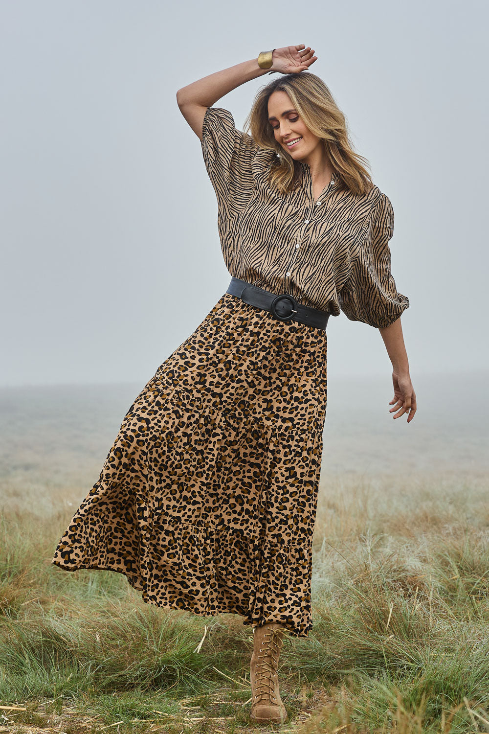 Model Tegan wearing size 10 of the Wild Side Cotton Blouse in colour Zebra (Black), from the front, showing the whole outfit