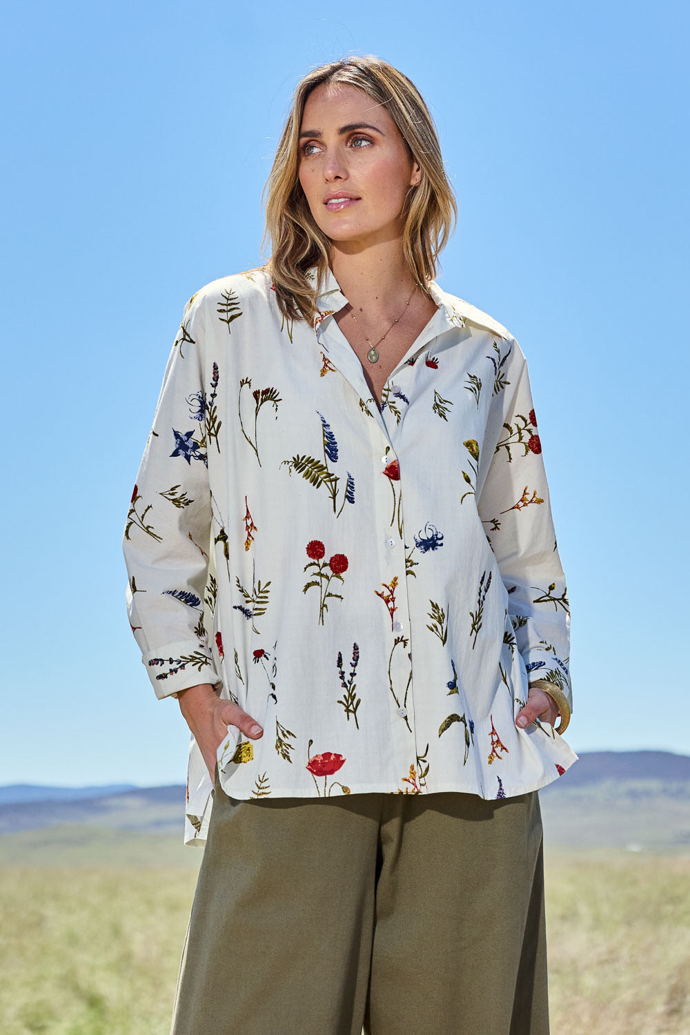 Model Tegan wearing size 10 of the Bouquet For Me Batwing Shirt in colour Fleur, from the front, showing the whole outfit