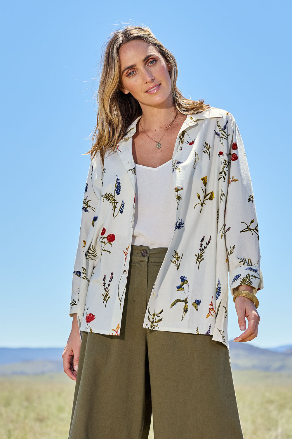Model Tegan wearing size 10 of the Bouquet For Me Batwing Shirt in colour Fleur, from the front, showing the whole outfit