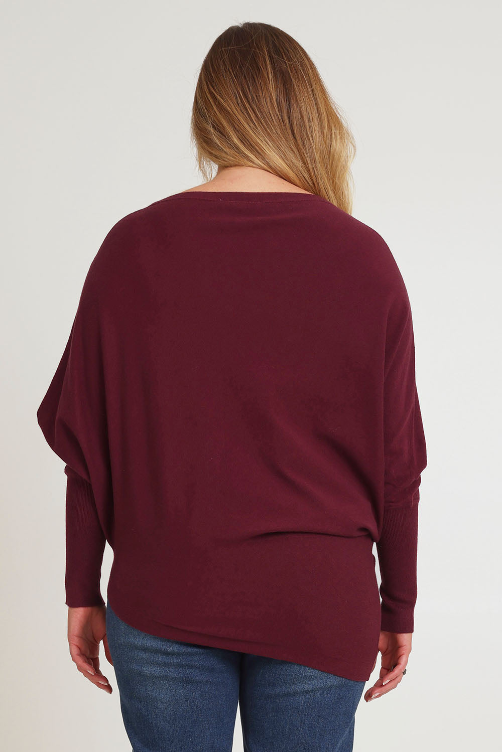 Model Chanel wearing size S of the Snuggle Up True Knit Jumper in colour Plum (Purple), from the back