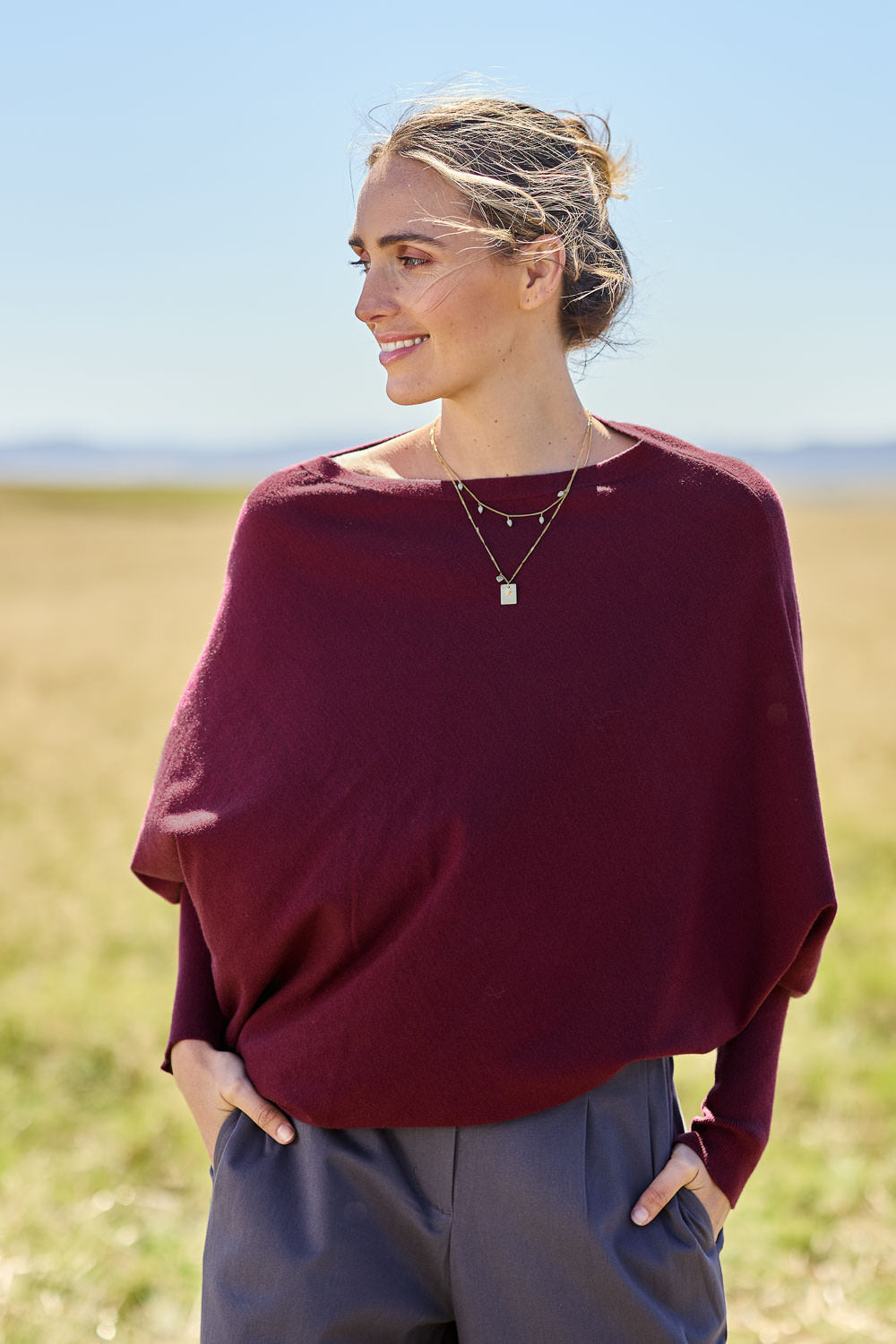 Model Tegan wearing size S of the Snuggle Up True Knit Jumper in colour Plum (Purple), from the front, cropped image