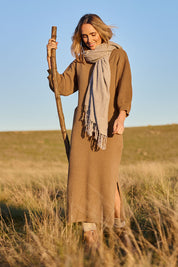 Model Tegan wearing size S of the Come As You Are Cotton Knit Dress in colour Camel, from the front, showing the whole outfit