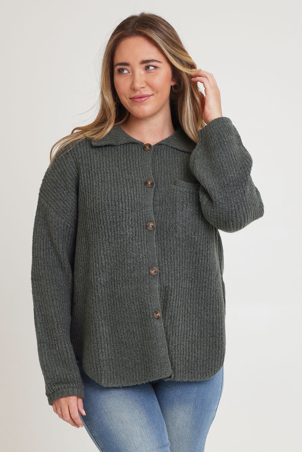 Model Chanel wearing size XL of the Cuddle Up To Me Knit Cardi in colour Gumnut (Green), from the front, cropped image