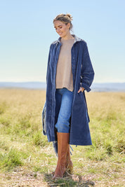 Model Tegan wearing size 10 of the High Impact Cord Dress in colour Blue (Blue), from the front, showing the whole outfit