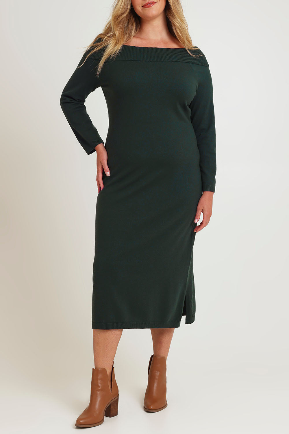 Model Chanel wearing size XL of the Winter Sun Off Shoulder Knit Dress in colour Forest (Green), from the front, cropped image