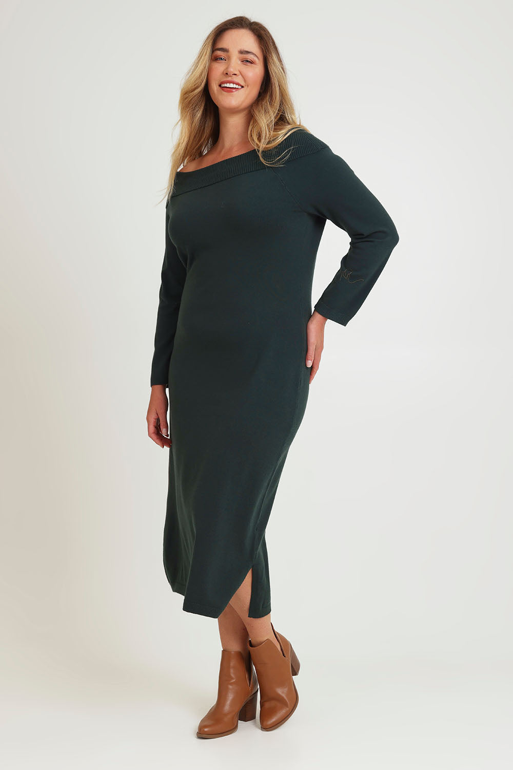 Model Chanel wearing size XL of the Winter Sun Off Shoulder Knit Dress in colour Forest (Green), from the front, showing the whole outfit