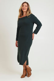 Model Chanel wearing size XL of the Winter Sun Off Shoulder Knit Dress in colour Forest (Green), from the front, showing the whole outfit