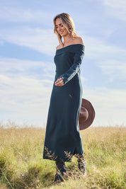 Model Tegan wearing size S of the Winter Sun Off Shoulder Knit Dress in colour Forest (Green), from the front, showing the whole outfit