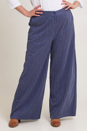 Model Chanel wearing size 16 of the Walk This Way Wide Leg Pants in colour Bluestripe (Blue), from the front, cropped image