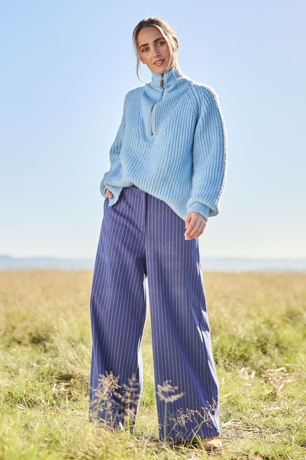 Model Tegan wearing size 10 of the Walk This Way Wide Leg Pants in colour Bluestripe (Blue), from the front, showing the whole outfit