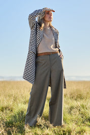 Model Tegan wearing size 10 of the Walk This Way Wide Leg Pants in colour Chocstripe, from the front, showing the whole outfit