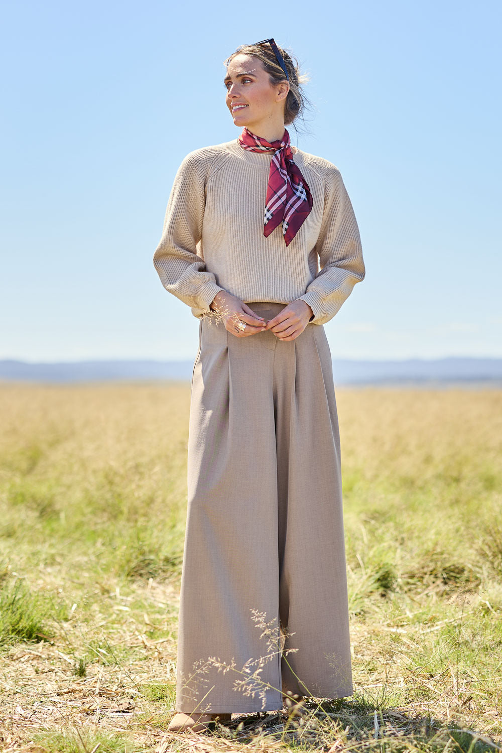 Model Courtney wearing size 10 of the Always Ready Cross Front Wide Leg Pants in colour Rock, from the front, showing the whole outfit