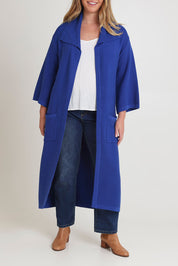Model Chanel wearing size XL of the Delight Me Long Cotton Cardi in colour Electric (Blue), from the front, cropped image