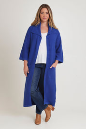 Model Chanel wearing size XL of the Delight Me Long Cotton Cardi in colour Electric (Blue), from the front, showing the whole outfit