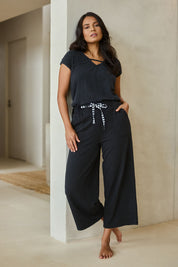 Model Tahnee wearing size 10 of the Relax Wide Leg Cotton Blend Lounge Pant in colour Washedblk (Black), from the front, showing the whole outfit