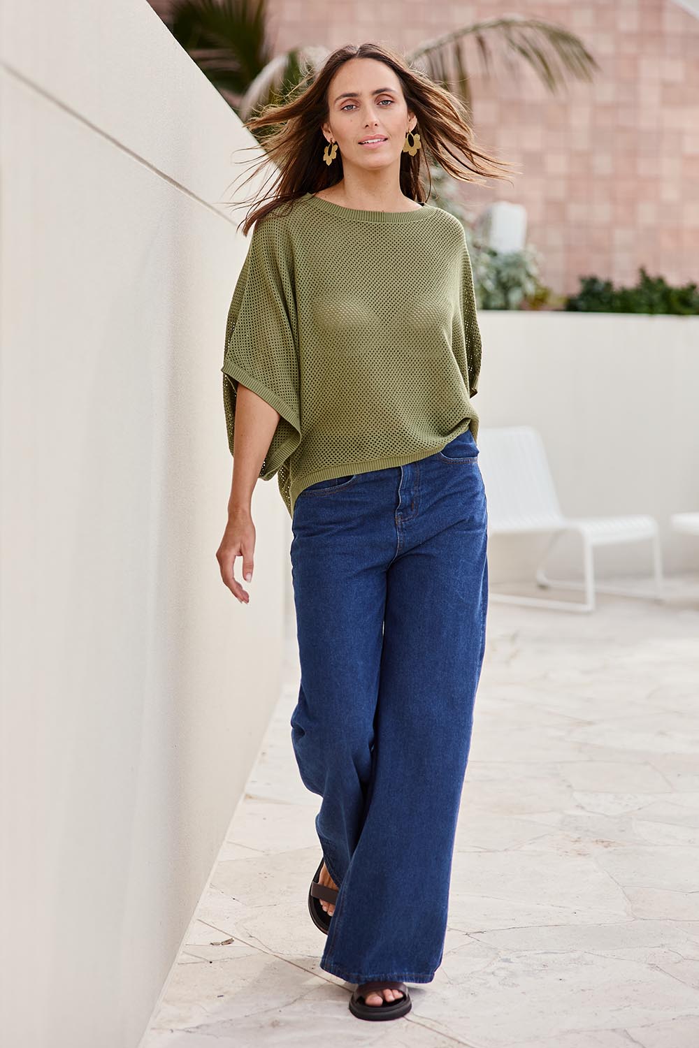 Model Tegand wearing size 10 of the Summer Ready Cotton Throw Sweater – Moss in colour Moss, from the front