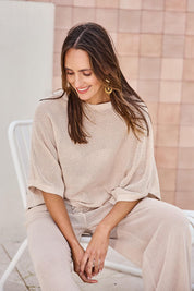 Model Tegand wearing size 10 of the Summer Ready Cotton Throw Sweater – Natural in colour Natural, in a cropped view