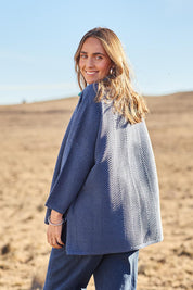 Model Tegan wearing size S of the Easy Does It Knit Top in colour Denim (Blue), from the front, showing the whole outfit