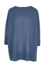 Product shot of the Easy Does It Knit Top in colour Denim (Blue), from the back