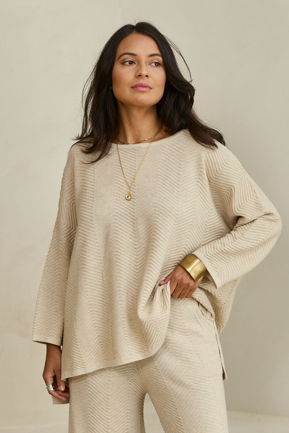 Model Tahnee wearing size S of the Easy Does It Knit Top in colour Natural, from the front, showing the whole outfit